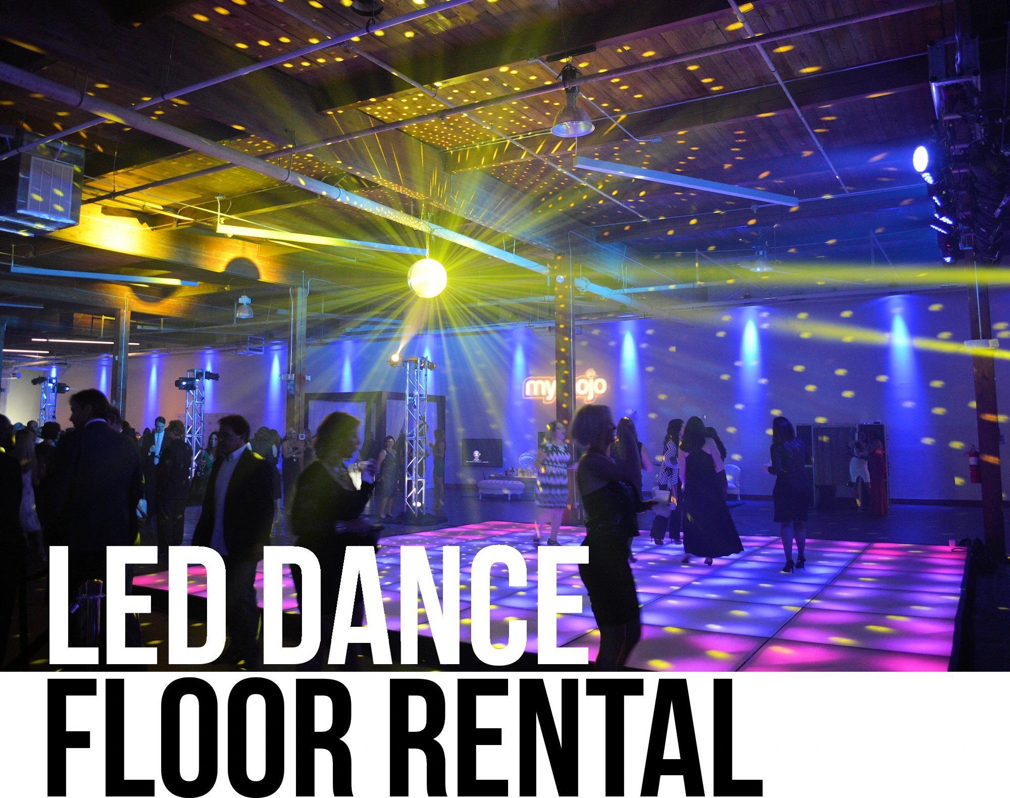 Large, square, lighted dance floor in blue within a restaurant and bar venue.